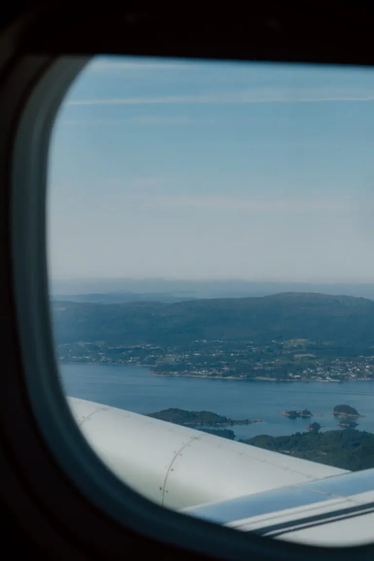airplane window view over coastal landscape